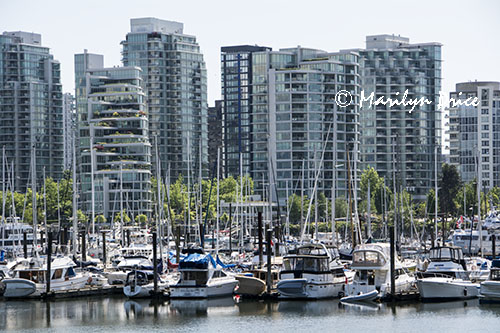 Skyline and boats from the sea wall at Stanley Park, Vancouver, BC