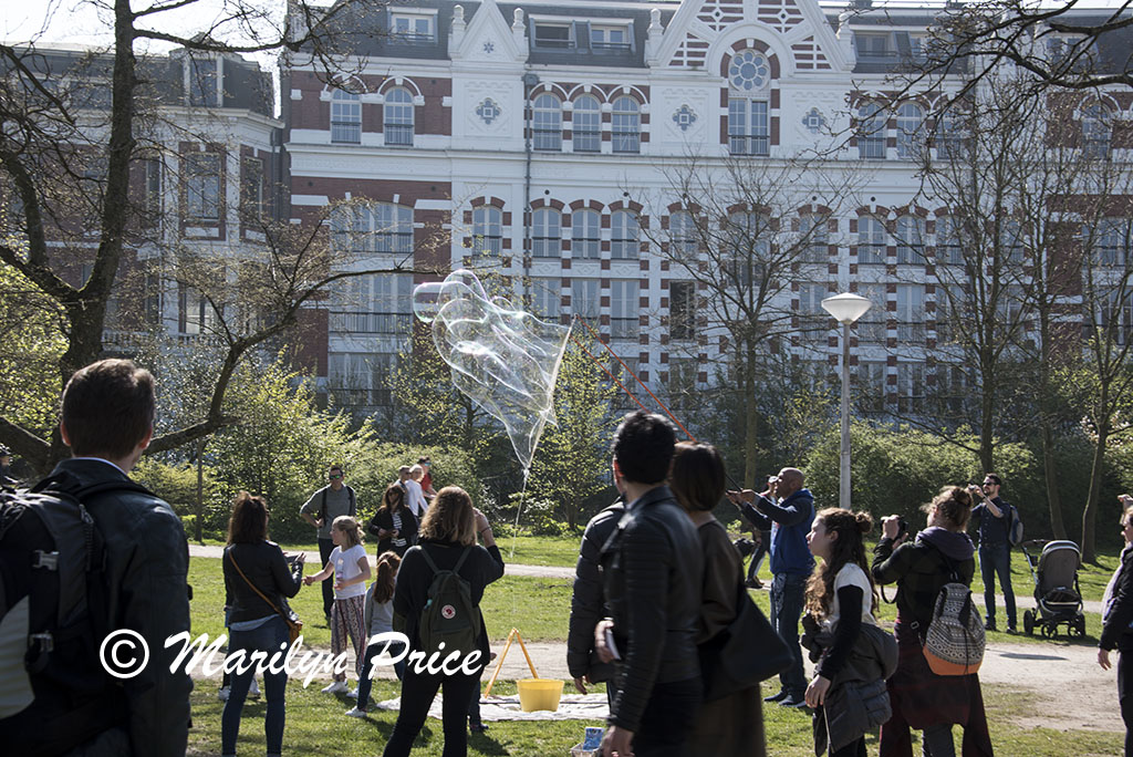 Blowing giant soap bubbles in Vondel Park, Amsterdam, Netherlands