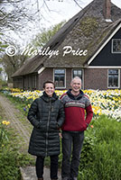 Owners of the house with a front yard full of daffodils, Sint Maartenszee, Netherlands