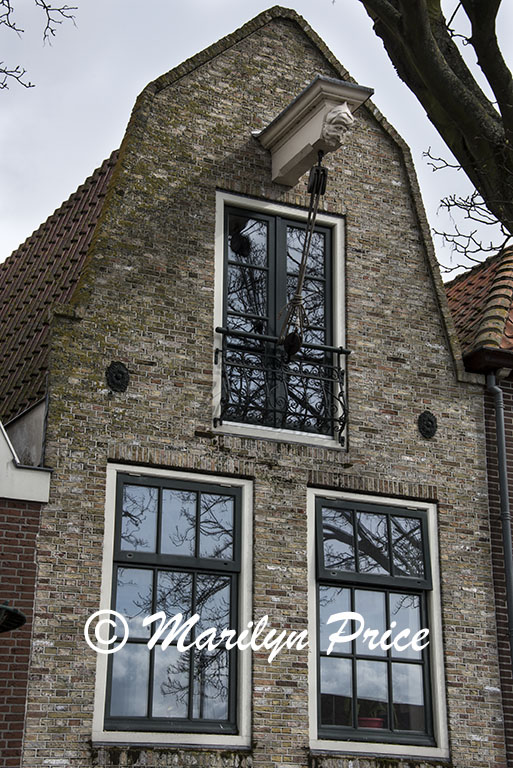 Front of a house with block and tackle, Hoorn, Netherlands