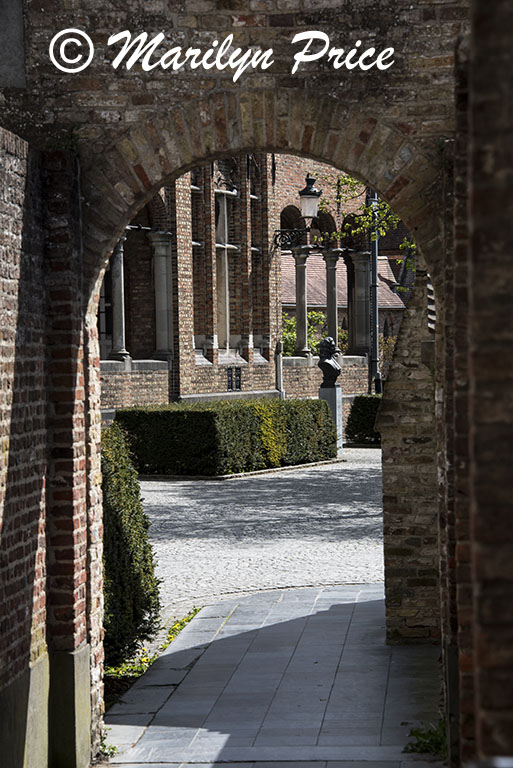 Passageway into a courtyard by Old St. Jan, Bruges, Belgium