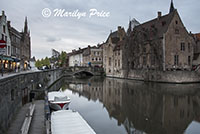 Buildings (including a bridge) reflected in a canal, Bruges, Belgium