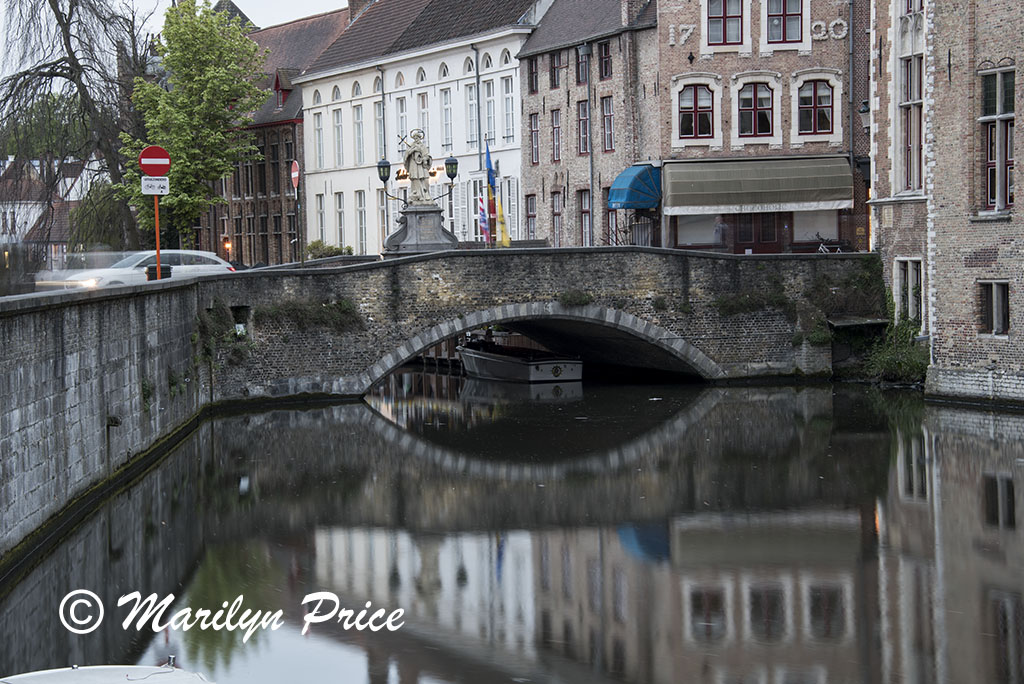 Buildings (including a bridge) reflected in a canal, Bruges, Belgium