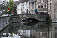Buildings (including a bridge) reflected in a canal, Bruges, Belgium