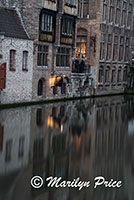 Buildings reflected in a canal, Bruges, Belgium