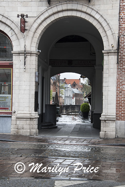 Arched entrance to an outdoor restaurant, Bruges, Belgium