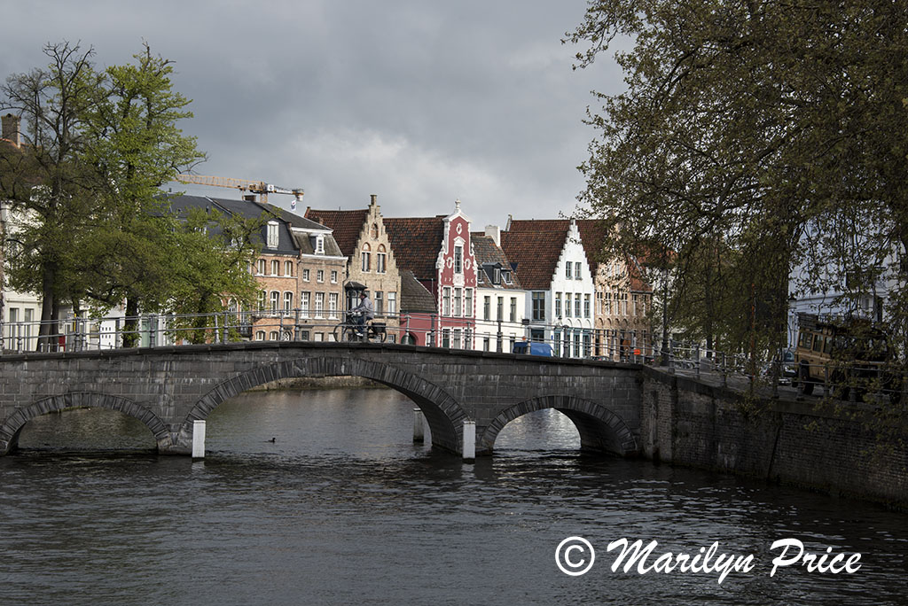Bicyclist crossing a bridge, Bruges, Belgium