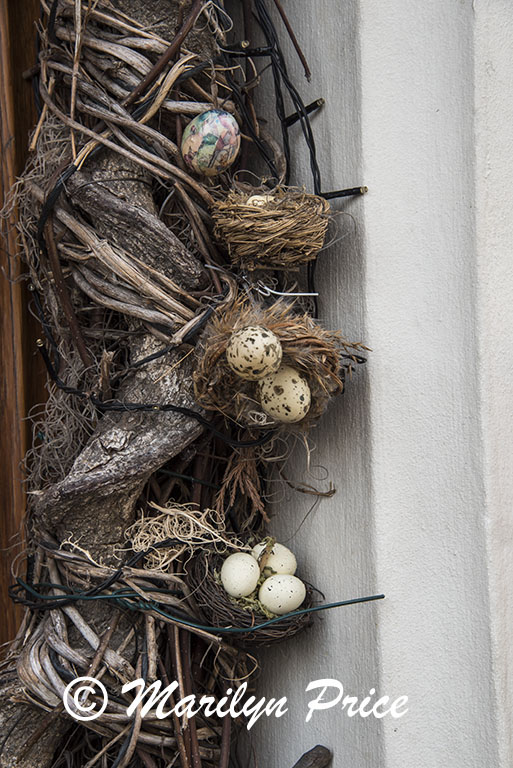 Decorations around a doorway (bird nests with eggs), Bruges, Belgium