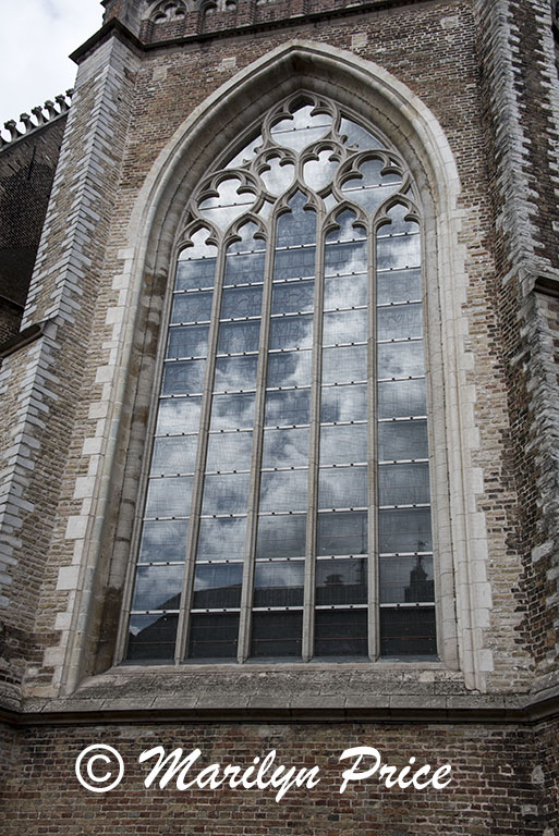 Clouds reflected in the windows of St. Salvators Cathedral, Bruges, Belgium