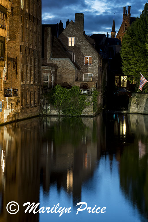 Buildings reflected in a canal (twilight), Bruges, Belgium