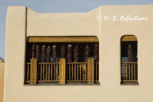 Ristras decorate a balcony, Santa Fe, NM