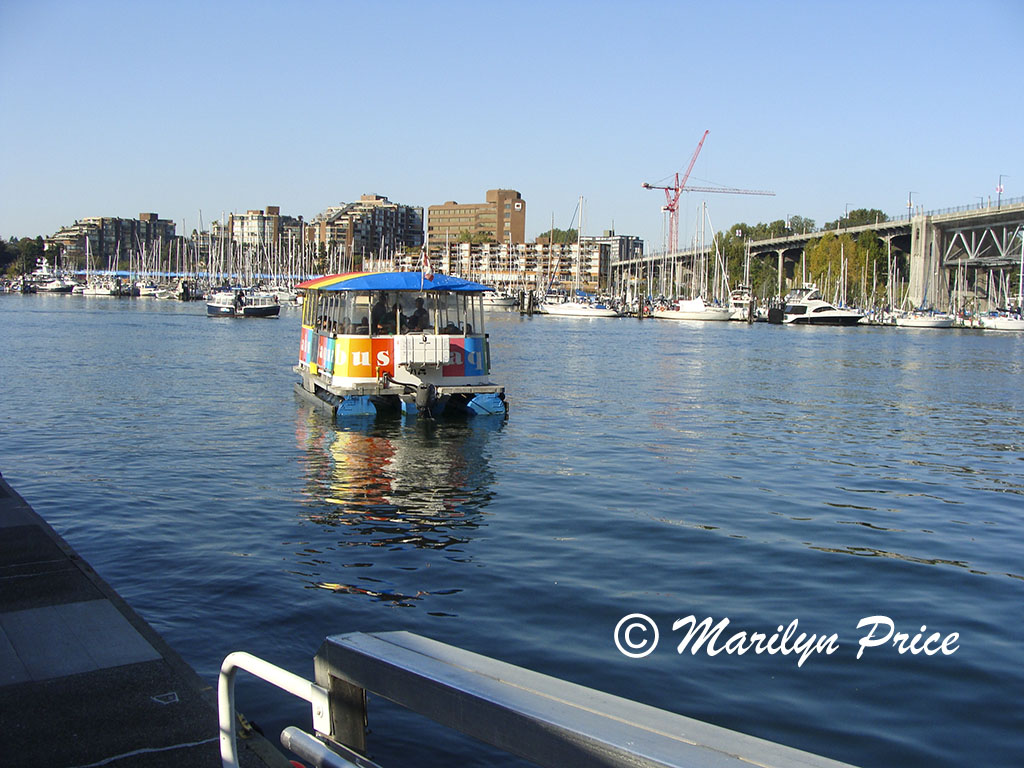 Aquabus pulling away from the Hornby Street Landing, Vancouver, BC, Canada