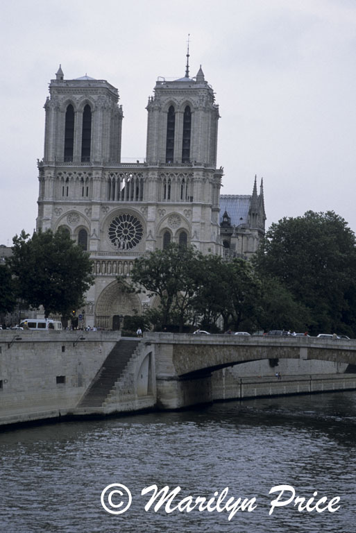 Main facade of the Cathedral of Notre Dame de Paris with the River Seine, Paris, France