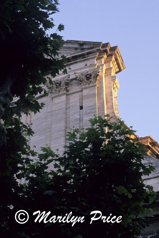 Early sunlight strikes a corner of the church facade, Beaucaire, France
