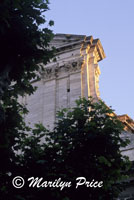 Early sunlight strikes a corner of the church facade, Beaucaire, France
