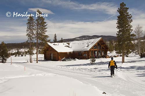 Carl nears the headquarters of the Frisco Nordic Center on snowshoes, Frisco, CO