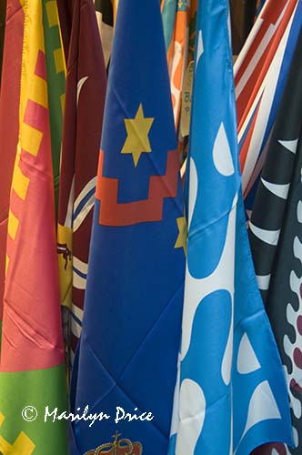 Store display of Palio flags, Siena, Tuscany, Italy