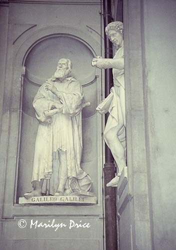 Galileo and another statue in Uffizi courtyard, Florence, Italy