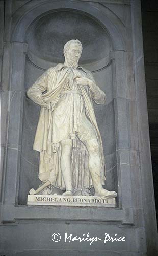 A statue of Michelangelo, Uffizi courtyard, Florence, Italy