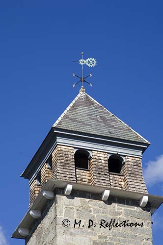 Geared weathervane atop an old mill, Newmarket, NH