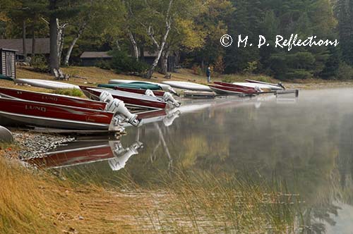 Boats pulled onto the shore, Nahmakanta Lake, ME