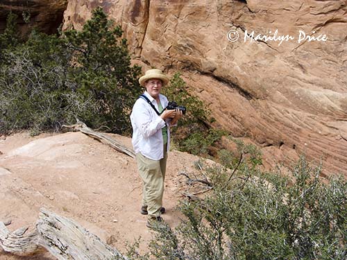 Marilyn shoots something near the Slot canyon, Joint Trail, Canyonlands National Park, UT