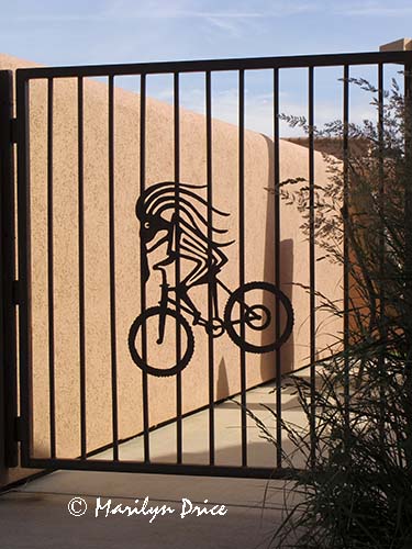 Kokopelli on a bicycle, gate at our condo, Moab, UT