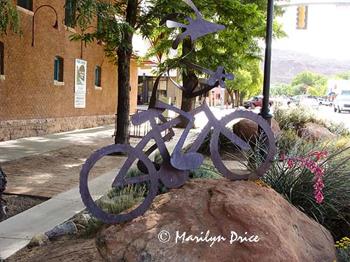 Kokopelli on a bicycle, statue on street, Moab, UT