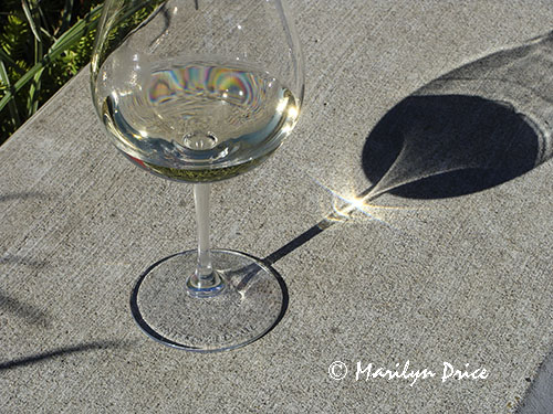 Sun and shadows through a wine glass