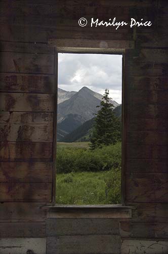 Looking through a window of an old cabin, Animas Forks, near Ouray, CO
