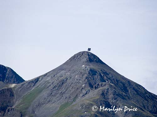 A weathered sign on top of a mountain, near Ouray, CO