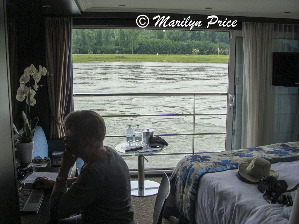 Marilyn and stateroom with open French balcony doors, Rhine River, Germany