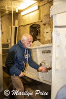 On site volunteer demonstrates lifting the cannon from its resting position, Maginot Line bunker, Lembach, France