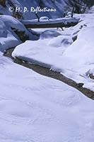 Snowy creek and log bridge, along Mossy Creek Trail, Bryce Canyon National Park, UT