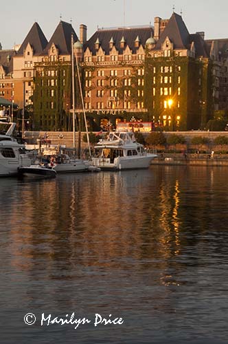 The Empress Hotel reflecting in the waters of the harbor, Victoria, BC