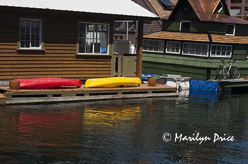 Kayaks and a bicycle on houseboats, Fisherman's Wharf, Victoia, BC