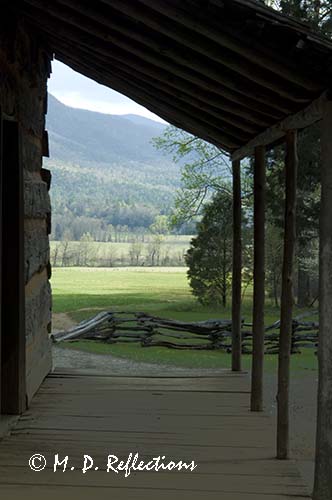 Looking over the valley of Cades Cove through the porch of the John Oliver Place, Cades Cove, Great Smoky Mountains National Park, TN